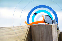 Sunglasses left on beach boardwalk.
