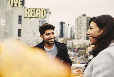 Man and woman having a conversation outside