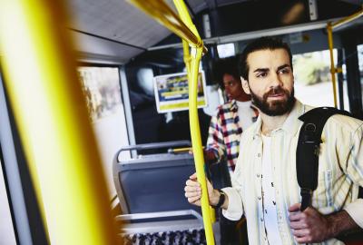 Man standing in bus.