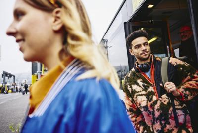 People getting out of a bus.